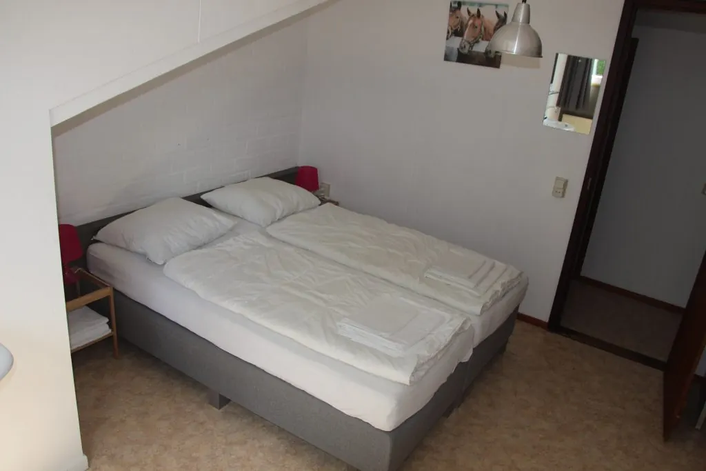 Een slaapkamer in Waterval